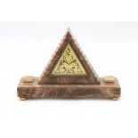 Art DecoA triangular marble mantle clock with triangular dial with Art Deco numerals, on