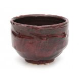 Ivan Weiss (1946)A dark red glazed stoneware bowl, signed underneath.12 cm. h. x 16 cm. diam.