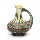 Wed. Brantjes & Co., PurmerendA ceramic pitcher with repeating stylized floral pattern, signed