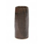 Ryozo Miki (1942)A brown glazed ceramic vase, cylindrical shaped base and hexagonal top rim, signed