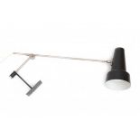 Willem HagoortA nickle-plated and black lacquered metal adjustable wall lamp with circular metal