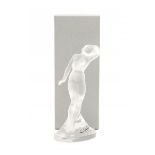 Lalique FranceA clear and frosted crystal figure of a dancing female nude, one arm above her head,