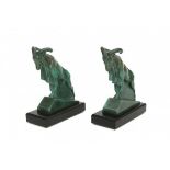 Max le Verrier (1891-1973)A pair of green patinated metal bookends shaped as mouflons, on black