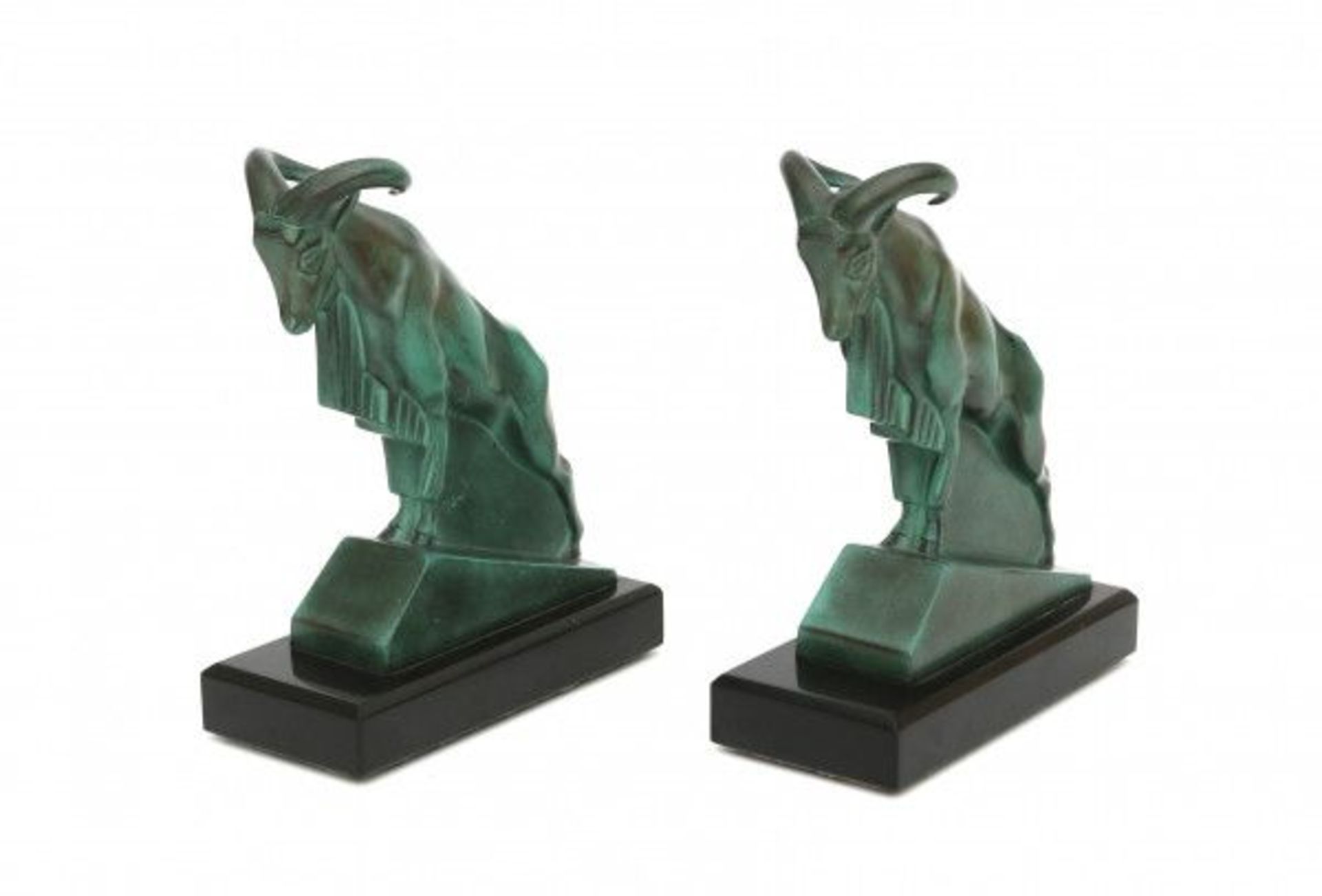 Max le Verrier (1891-1973)A pair of green patinated metal bookends shaped as mouflons, on black