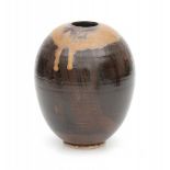 Ryozo Miki (1942)A brown glazed ceramic vase with lighter coloured drip glaze alongside the top