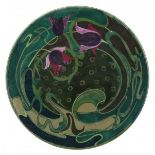 Plateelbakkerij Zuid Holland, GoudaA large ceramic wall plate with wavy floral pattern, with