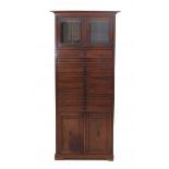 Nieuwe KunstA mahogany cupboard with thirteen drawers, the lower part with two cupboard doors, the