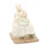 Henri Teixeira de Mattos (1856-1908)A ceramic figure of a seated mother and child, produced by