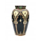 N.V. Haagsche Plateelfabriek Rozenburg, Den Haag (1883-1917)A tall ceramic vase decorated with