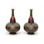 N.V. Haagsche Plateelfabriek Rozenburg, Den Haag (1883-1917)A pair of flask-shaped ceramic vases