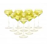 JugendstilTen white wine glasses with facet cut stems and green cuppa with gilt pattern, German/