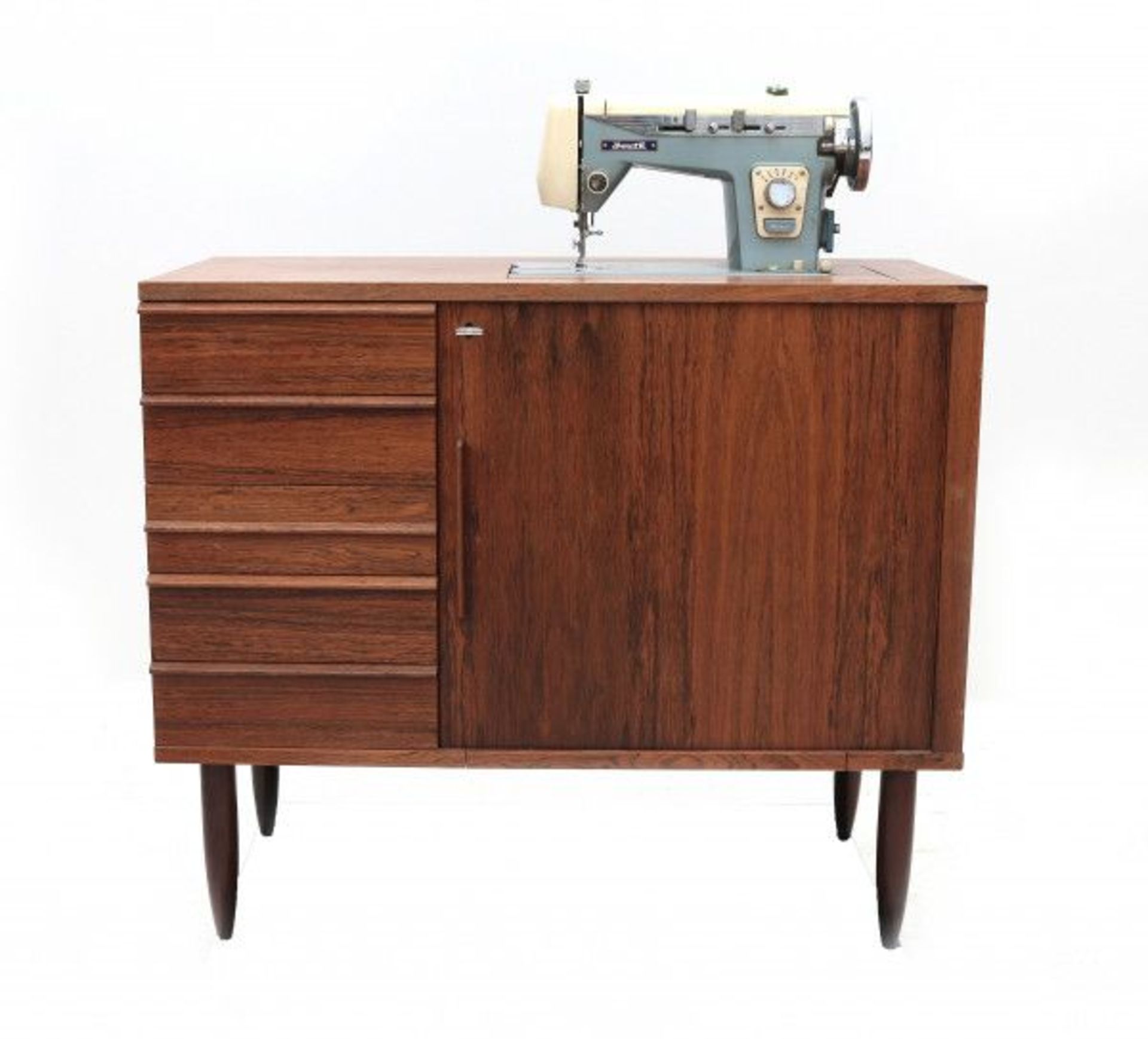 Midcentury ModernA teak veneered sewing sideboard with sliding door and drawers, the sideboard