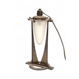 JugendstilAn adjustable patinated brass tablelamp with frosted glass shade, circa 1910.36 cm. h.