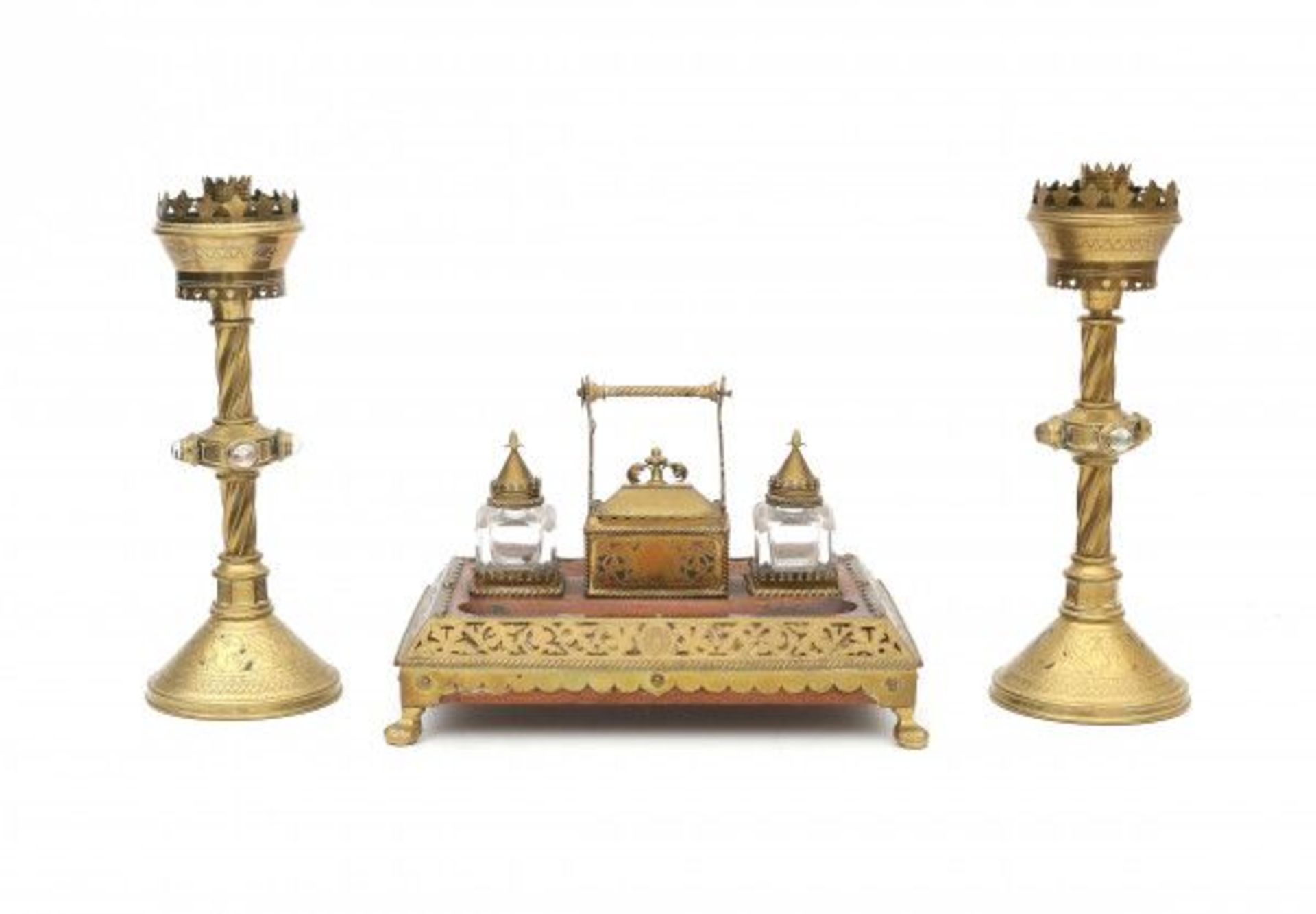 Arts & CraftsAn oak, glass and brass inkwell with matching pair of bronze candlesticks, the torded