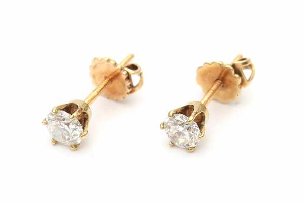 A pair of yellow gold solitaire earrings, set with old European cut diamonds, total ca. 0.90 ct,