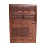 A Japanese two-part zelkova cabinet 'Heya-Dansu'. The front with drawers and sliding doors. The