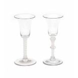 Two English 'twist' wineglasses, one 'knopped', both with white double spiral. 18th centuryheight 17