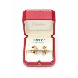 A pair of tri colour gold earrings of Cartier, serie Trinity, 1997. With certificate and both boxes.