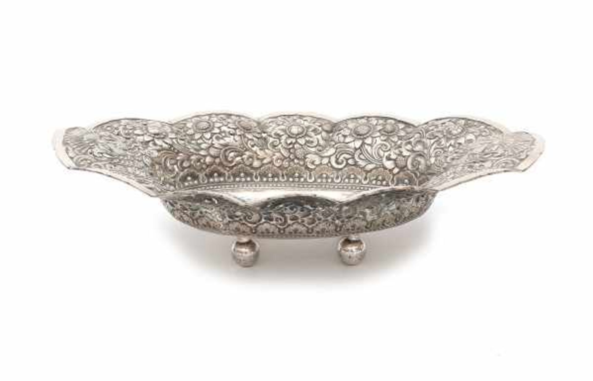An oval Djokja silver basket, decorated with flowers and peacocks. Indonesia, 20th century.Length 41