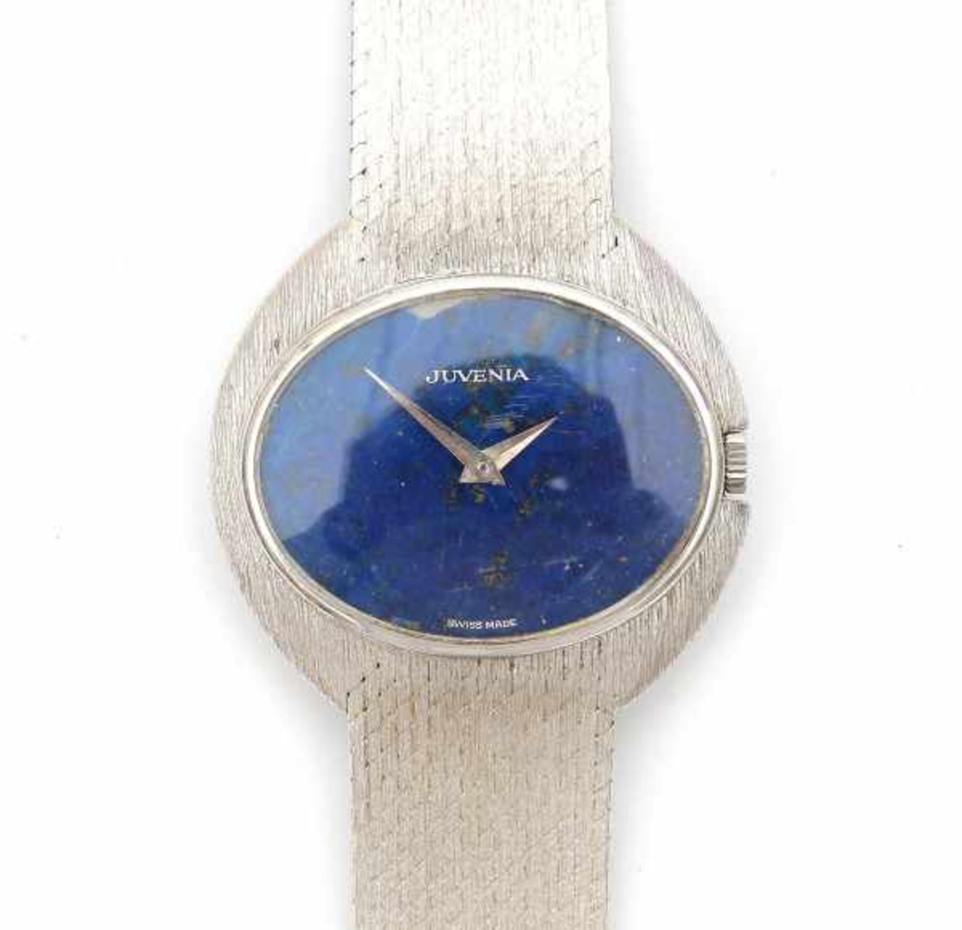 An 18 carat white gold lady's wrist watch with oval lapis lazuli dial. Hour with manual winding.