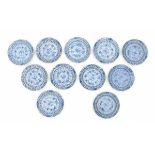 A set of eleven Chinese blue and white saucers, decorated with carp and sturgeon. With four