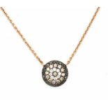 A rose gold necklace with round diamond set pendant. Pendant set with black, brown and white