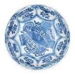 A Chinese blue and white transitional dish, decorated with buddhist symbols surrounded by flowers.