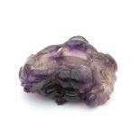 A carved amethyst lotus brush washer. 19th century.3 x 7,5 x 7 cm.- - -29.00 % buyer's premium on