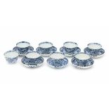 A set of seven Chinese blue and white cup and saucers, decorated with flowers and landscapes in