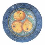 A Dutch maiolica 'pomegranate' plate, the rim decorated with studs. Late 16th centuryDiameter 20