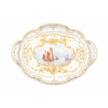 A porcelain serving tray, decorated with fishing boats leaving the harbour and highlighted with gold