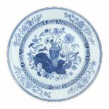 A Chinese blue and white charger, decorated with a vase and various flowers. 18th centuryDiameter 38