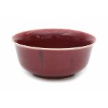 A Chinese monochrome copper red 'lang yao hong' bowl. 20th century.Diameter 23 cm.- - -29.00 %