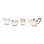 A Dutch four-piece Sterling silver tea service. The teacaddy without the key. Maker's mark Jacobus