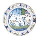 A Delft polychroom plate, decorated with two horses in the meadow. 18th century.Diameter 22,5 cm.- -