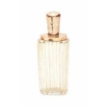 A cut crystal perfume bottle with 14 krt rose gold cap in original leather case from the 19th