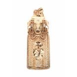 A Japanese ivory flask, decorated with musicians and dancers, the neck with draped ropes and