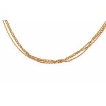 An 18 carat yellow gold three strand anchor type link chain necklace by Chopard. Length ca. 45 cm.