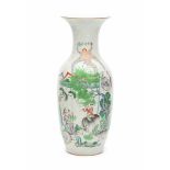 A Chinese famille rose vase, decorated with playing boys and scholars in a garden. Early 20th