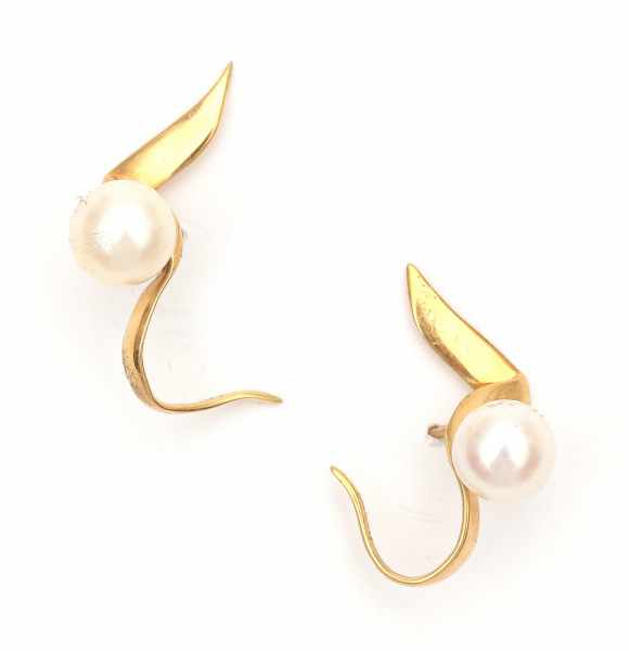 A pair of yellow gold earrings by Paloma Picasso for Tiffany & Co, 1983. Set with cultured pearls