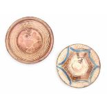 Two Hispano-Moresque dishes with luster glaze, decorated with a star and a floral pattern. 17th
