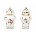A near pair of German potpourri jars, both decorated with a variety of flowers. Marked for Thüringen