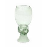 A German wine glass 'Roemer'. 17th centuryheight 13,5 cm.- - -29.00 % buyer's premium on the