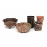A collection of South American pottery, a fire dish, a bowl and three vases. Possibly