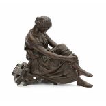 James Pradier (1790-1852)A bronze sculpture of a seated classical beauty with a lyre behind her.
