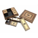 A French laquered games box, the interior with five small boxes. 19th century.8 x 29 x 25 cm.- - -