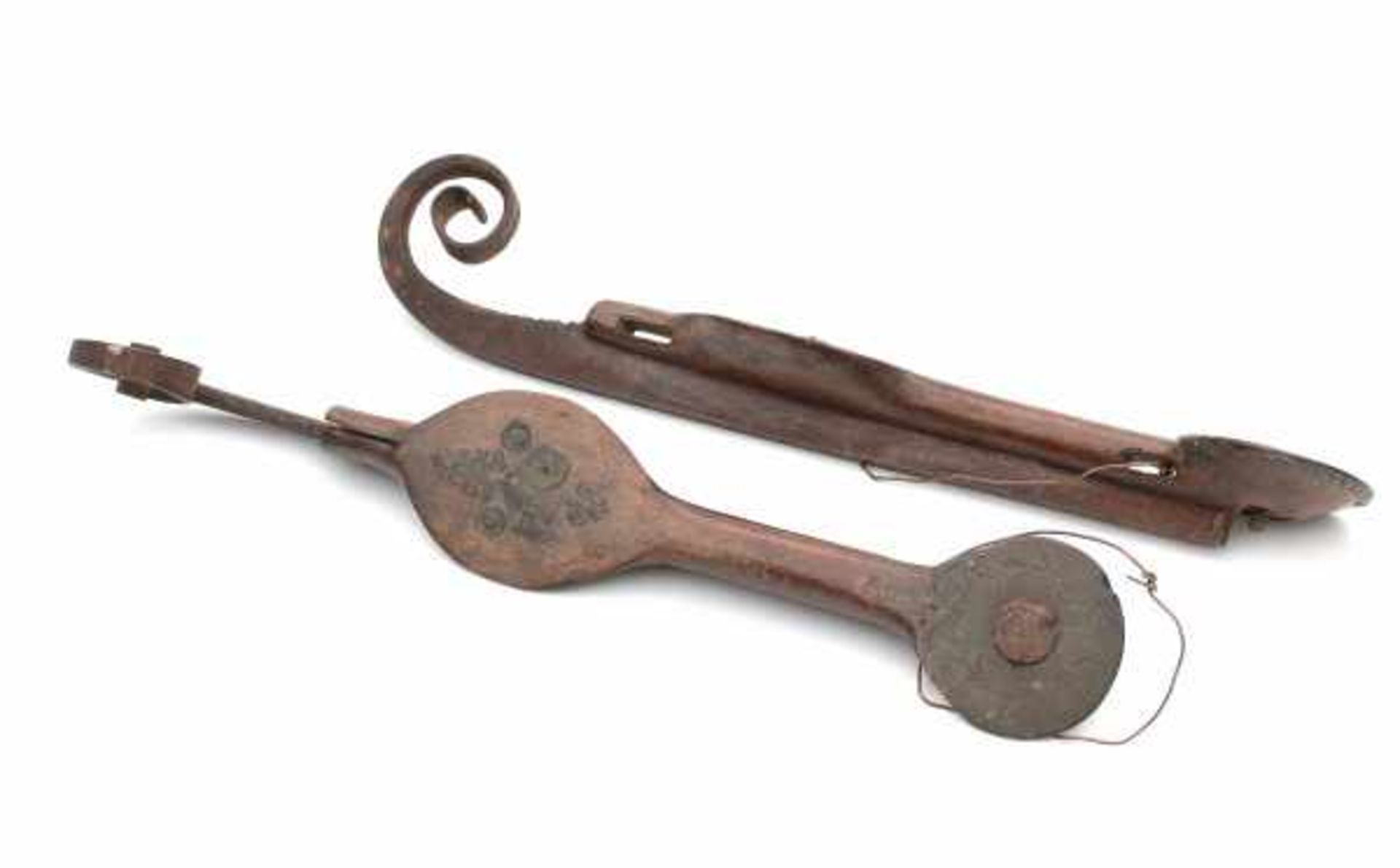 A pair of Dutch ice skates 'krulschaatsen', with copper mounts in the shape of a heart and a