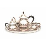 A three piece foreign silver tea set. With an oval silver tray. Imported by Begeer, v. Kempen &