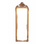A gilt mantle mirror. Circa 1900.223 x 68 cm.- - -29.00 % buyer's premium on the hammer price, VAT