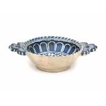 A Dutch maiolica porridge bowl, decorated with a monochrome blue pattern. Circa 1600Length 21 cm.- -